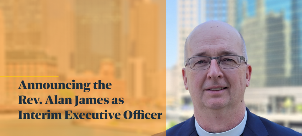 Image Description: A headshot of the Rev. Alan James. He is standing outside, in front of water, with a cityscape on the other side of the water. (It's Chicago.) Alan is a bald white man who is wearing glasses, a clergy collar and a sports jacket. Over the left side of the image is a semi-transparent orange color block with text below it in a bold serif font that reads, "Announcing the Rev. Alan James as Interim Executive Officer"
