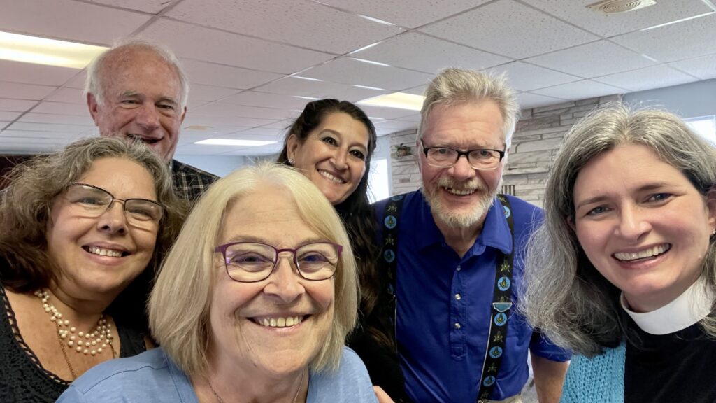 IMAGE DESCRIPTION: A group shot with six smiling people, including Canon Nurya, at Calvary Episcopal in Hillman.